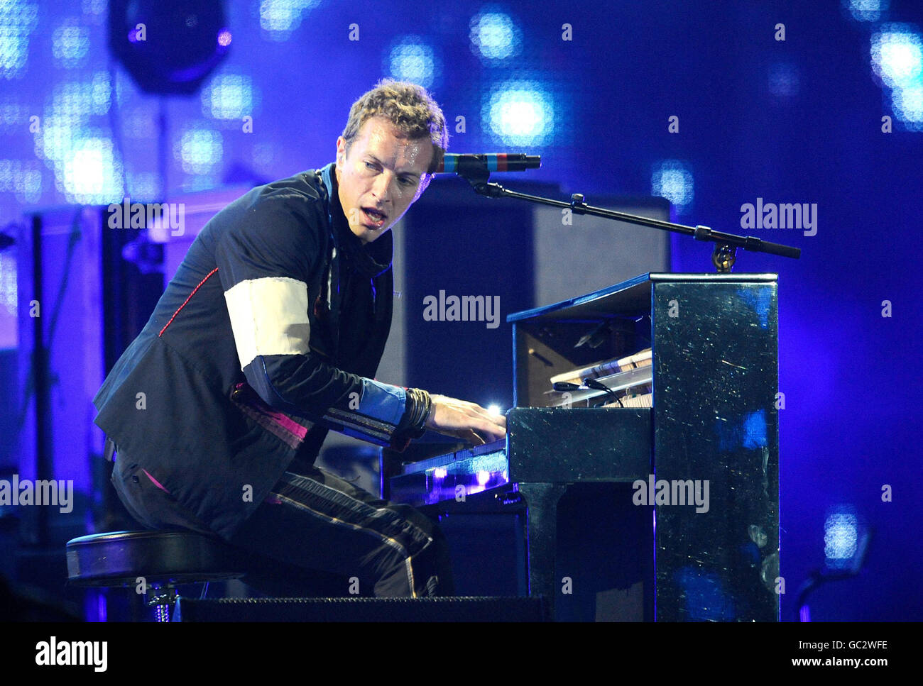 Chris Martin of Coldplay performs at Wembley Stadium, London. Stock Photo