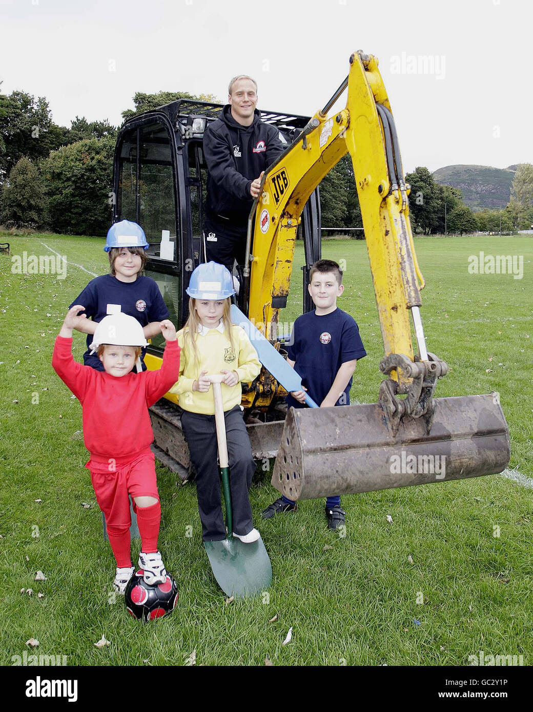 Edinburgh winger Andrew Turnbull (back) with children from Lismore RFC and Edinburgh South FC and Edinburgh Cricket Club during the launch of construction of a multi-sport facility for Inch Park Community Sports Club Centre at Inch Park, Edinburgh. Stock Photo
