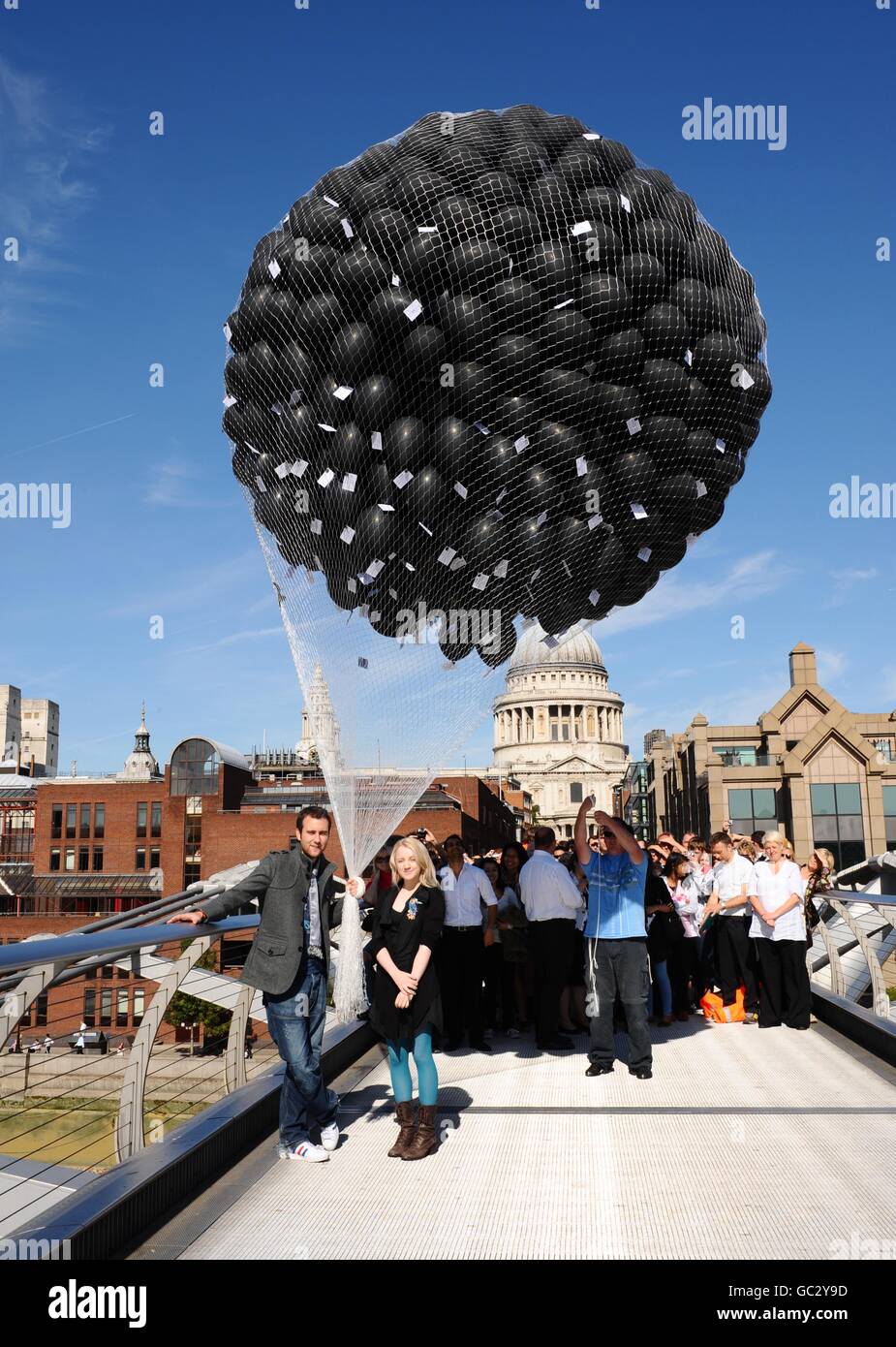 Actor Matthew Lewis (who plays Neville Longbottom) and actress Evanna Lynch (who plays Luna Lovegood) help release 1000 balloons tagged with cards, which will give the lucky recipient the chance to win a trip to the film set of the next Harry Potter film. In central London. Stock Photo