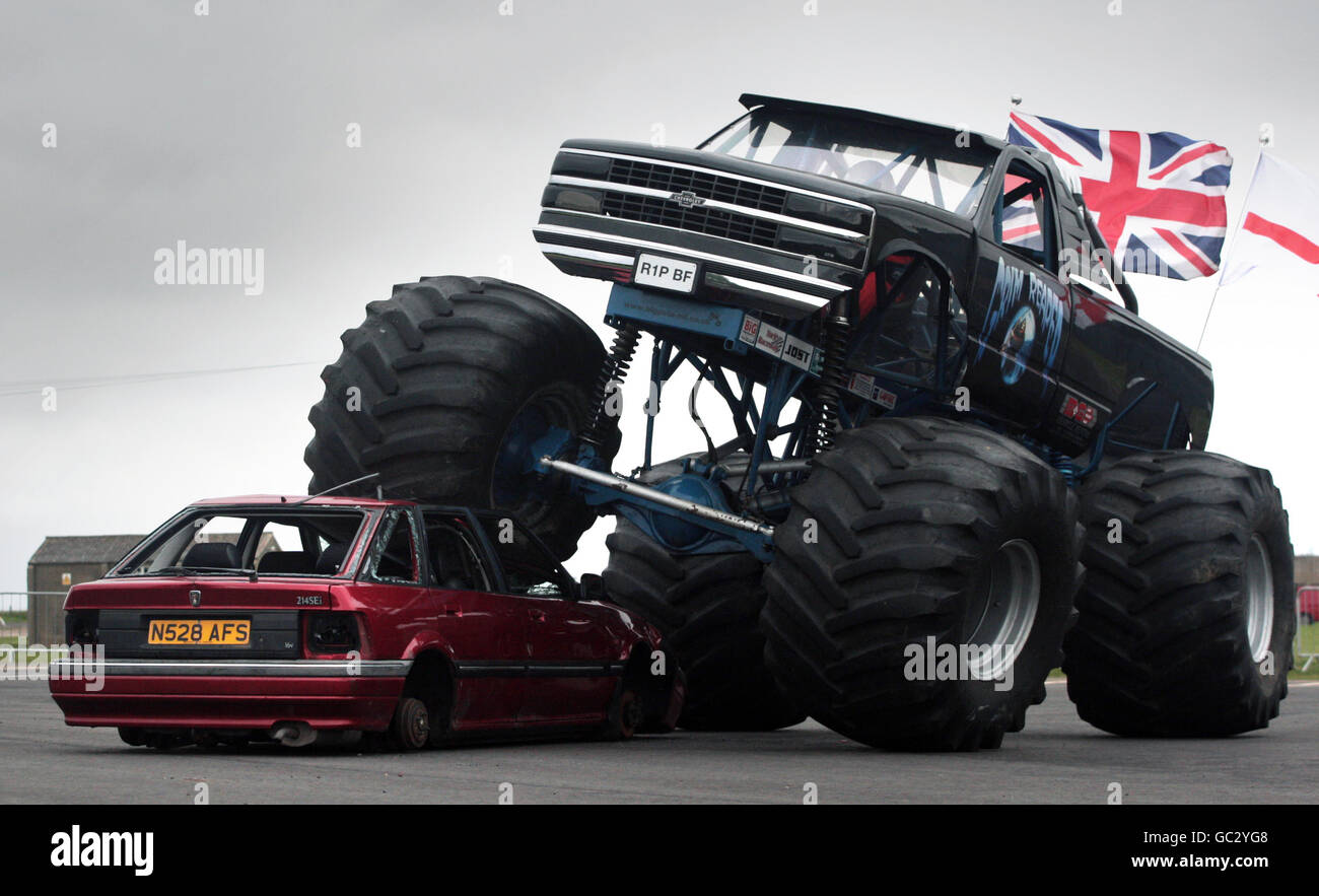 Sam Law driving the Grim Reaper monster truck during a demonstration of it's car crushing abilities at the National Museum of Flight near Edinburgh. Stock Photo