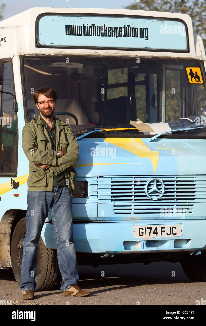Andy Pag, 34, with his 'Biotruck', a former school bus modified to run on used cooking oil, which he plans to drive around the world. Stock Photo