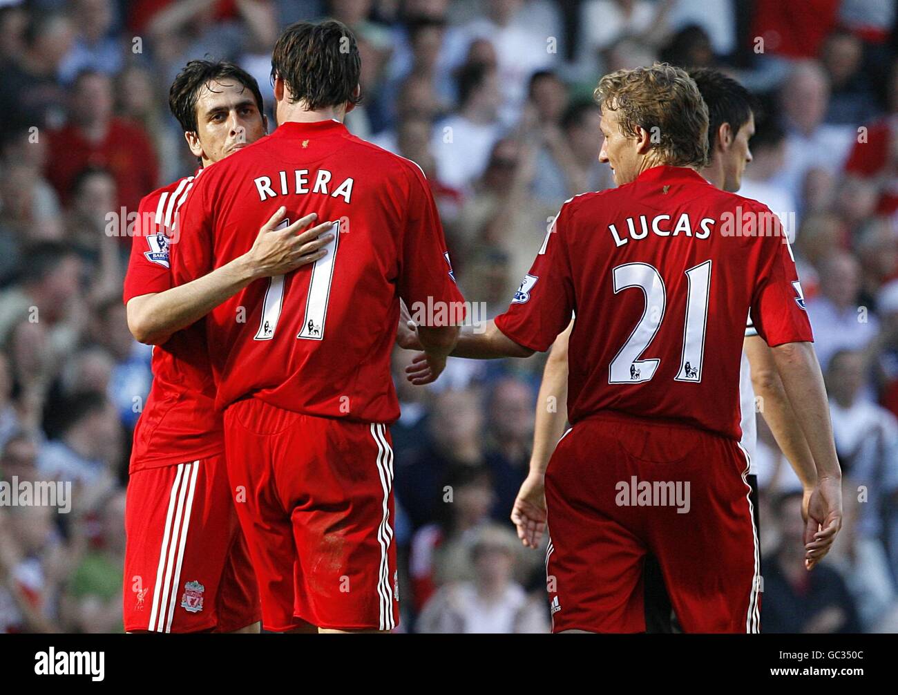 Liverpool's Yossi Benayoun (far left) celebrates with team mates Albert Riera (centre) and Lucas Leiva after scoring his side's fourth goal of the game, completing his hat-trick Stock Photo