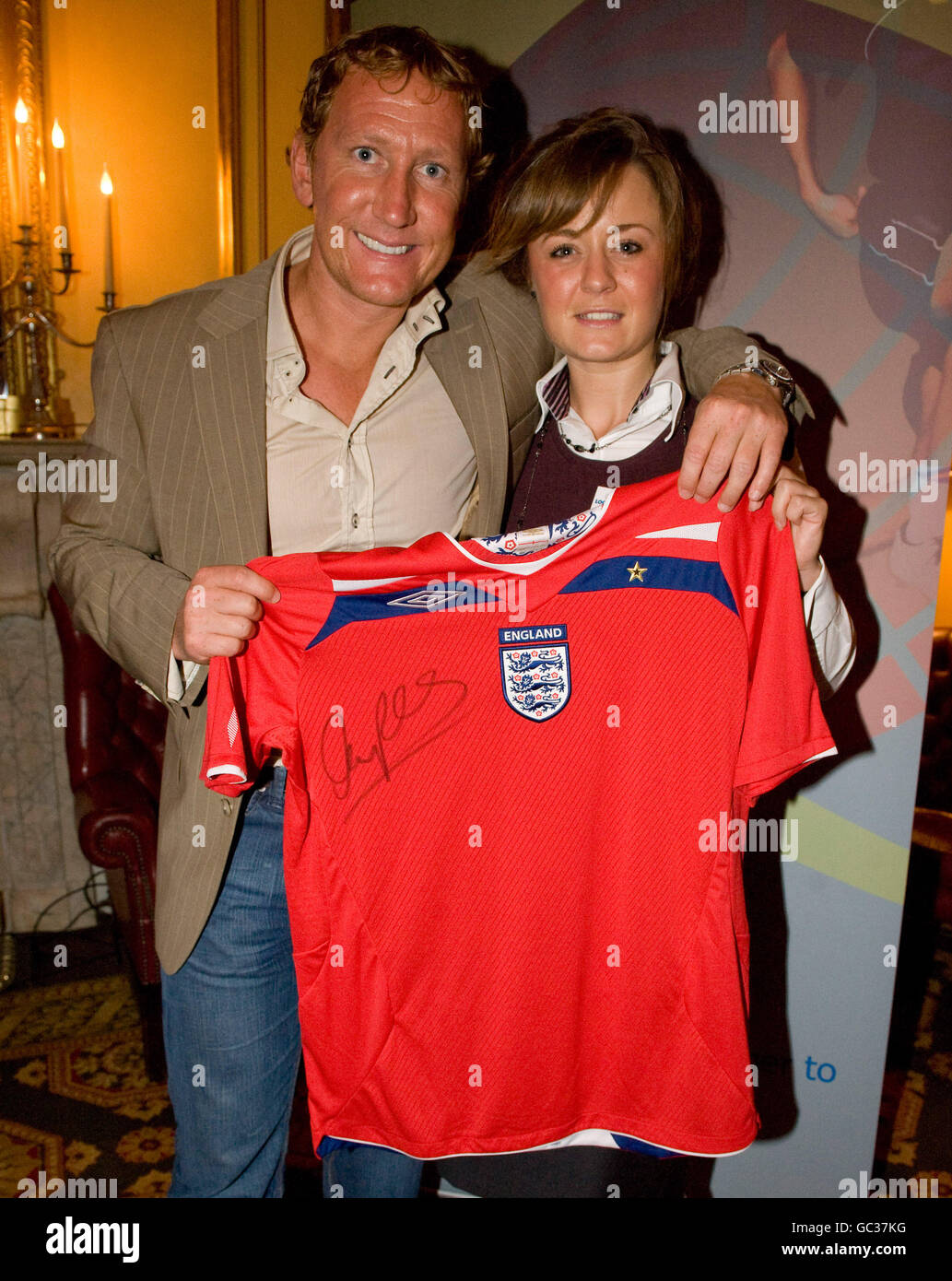 Ray Parlour presents a signed England shirt to a lucky winner at the ...