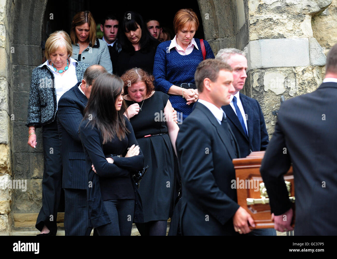 Family and friends of Jamie Kyne including his mother Madaline (centre) follow his coffin after his funeral mass at St Leonard and St Mary's Church, Malton. Stock Photo