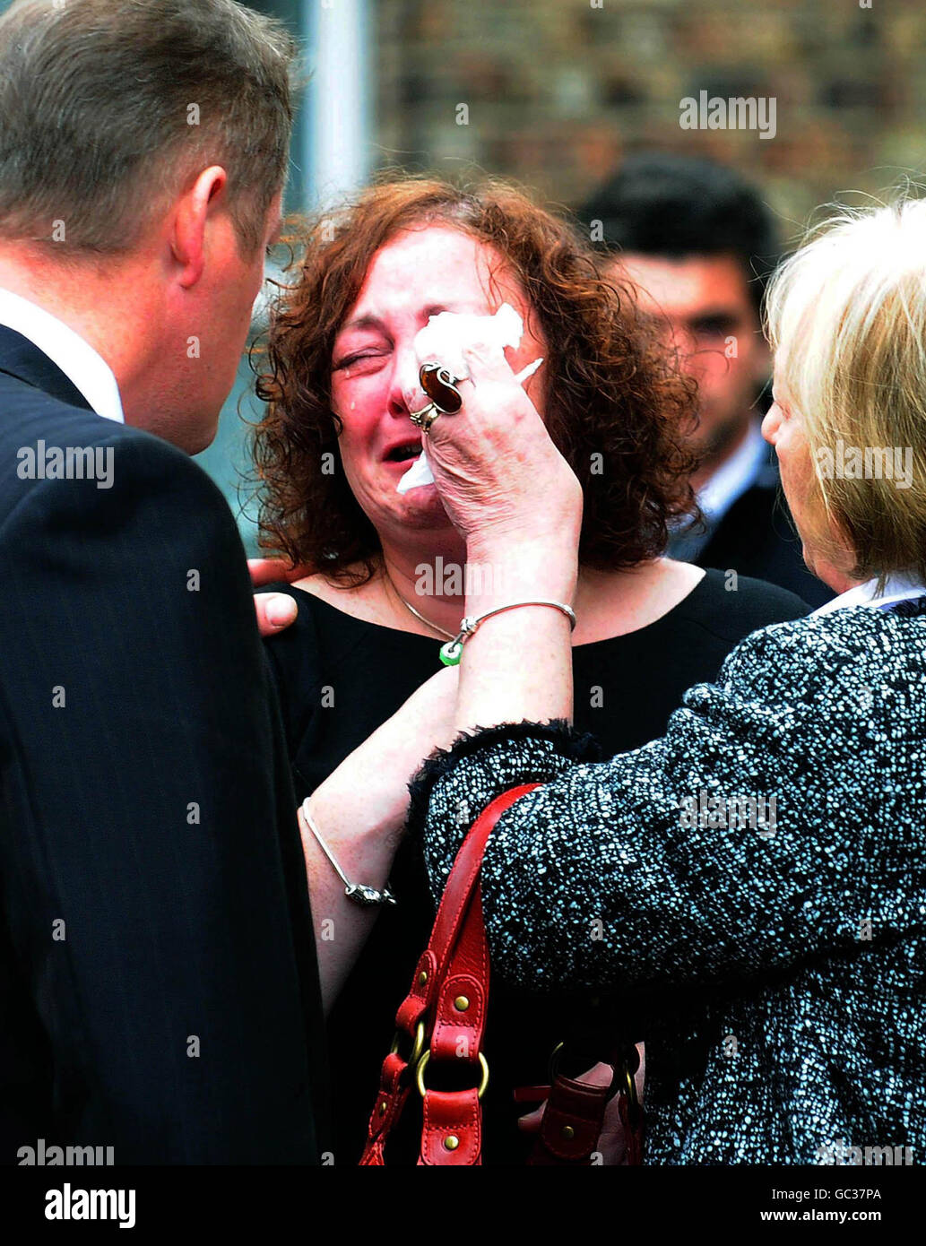 Jamie Kyne's mother Madaline is comforted after his funeral mass at St Leonard and St Mary's Church, Malton. Stock Photo