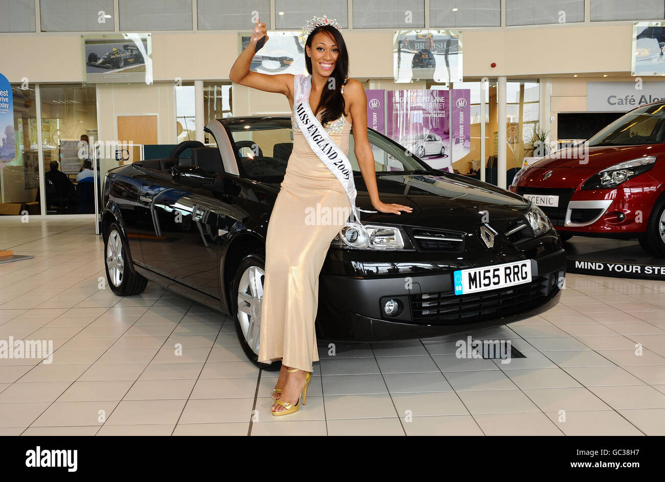 Miss England Rachel Christie receives the key to her new Renault Coupe Cabriolet, complete with personalised number plate (standing for Miss Renault Retail Group), from Renault London West. Rachel will keep the car until the end of her reign as Miss England. Stock Photo