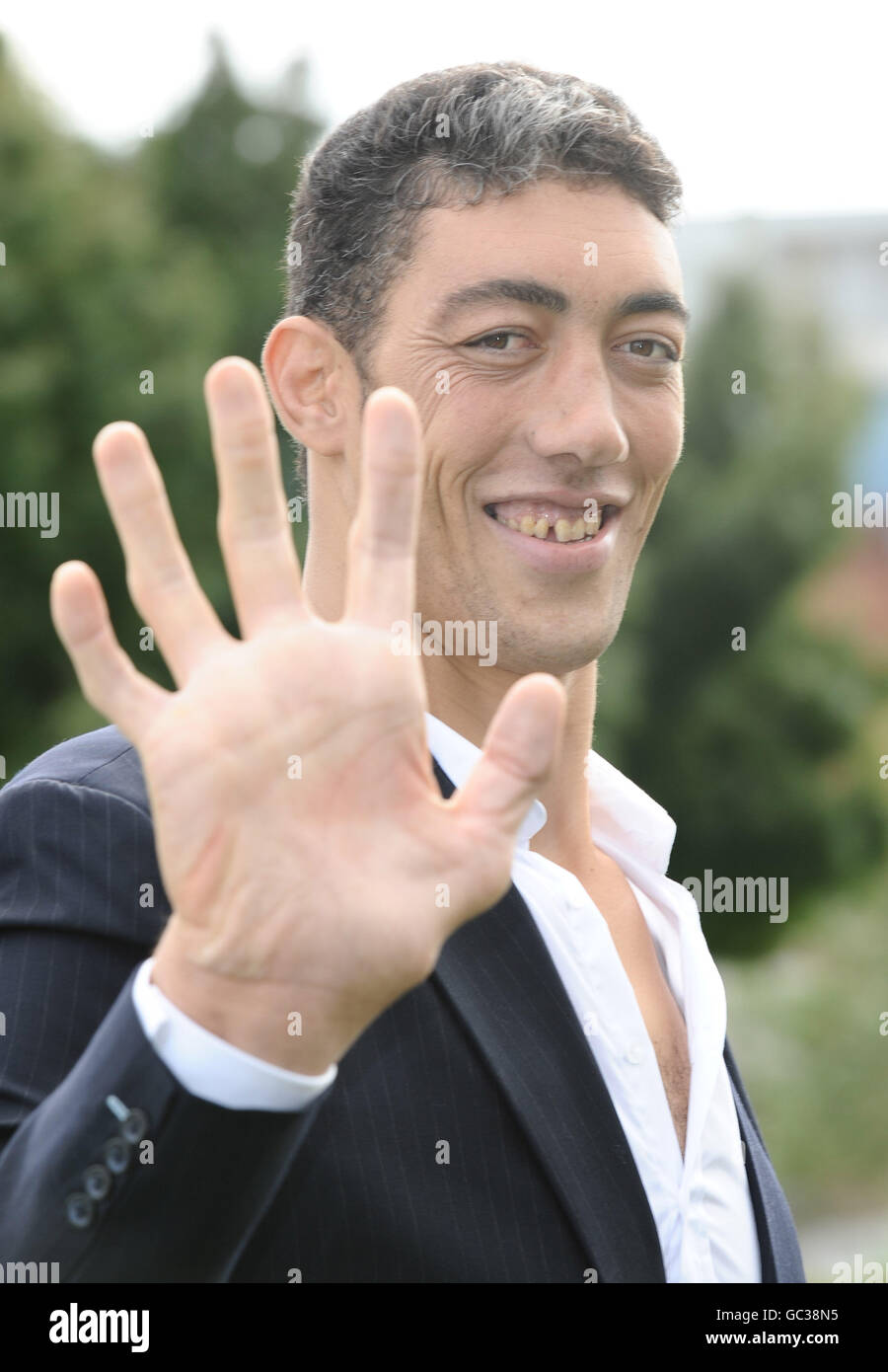 Sultan Kosen, from Turkey, is announced as the Guinness World Records Tallest Man standing at 8ft 1, and the record for the largest hands at 27.5cm, seen in Potters Field in London. Stock Photo