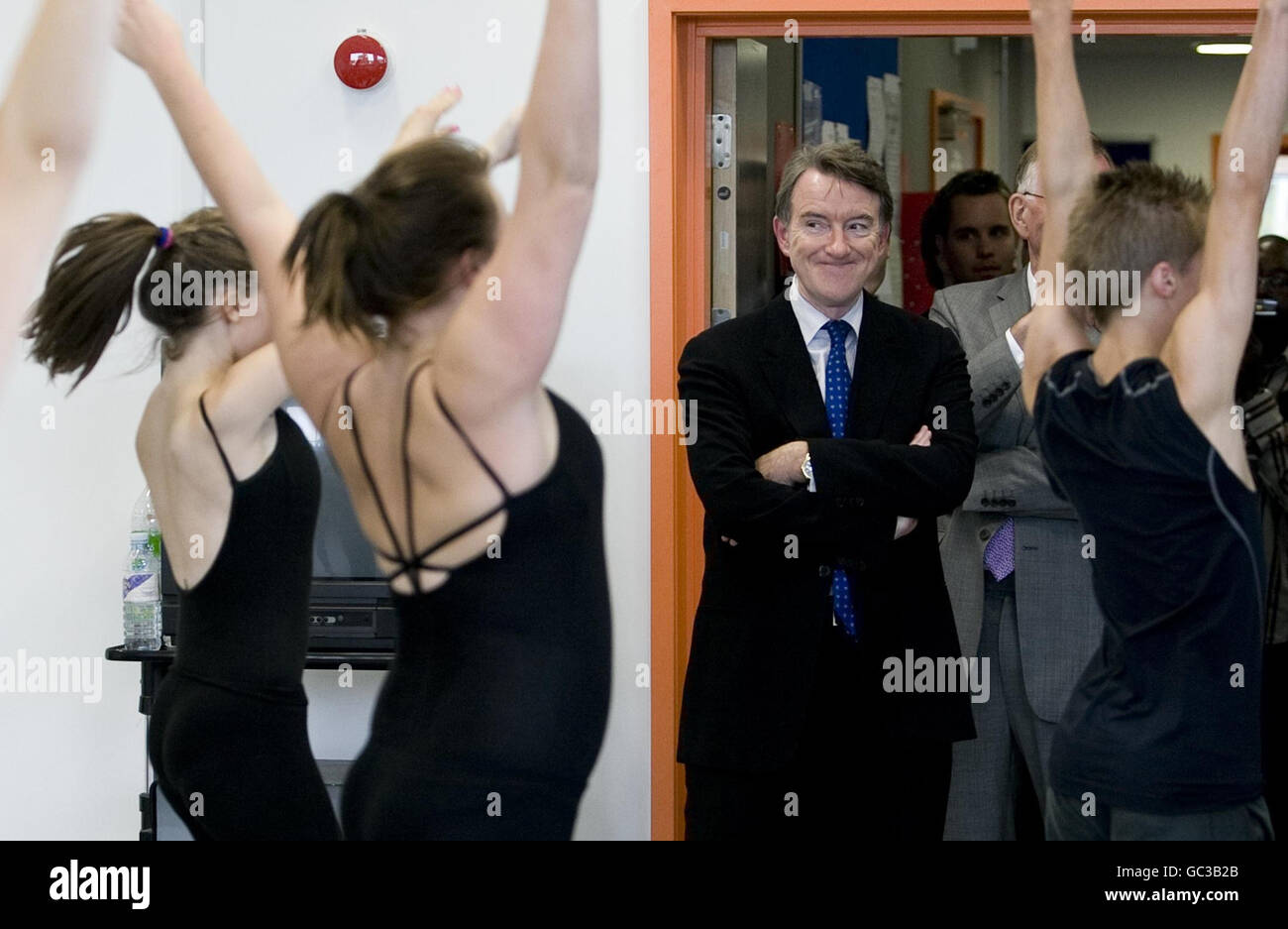 Business Secretary Lord Mandelson watches dancers during a visit to the the British School of Performing Arts in Croydon. Stock Photo