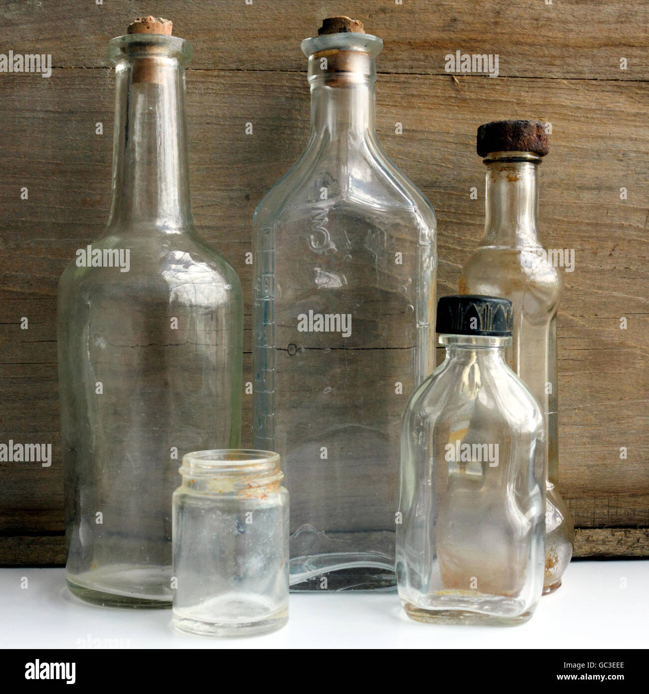 Antique clear glass bottles. Stock Photo
