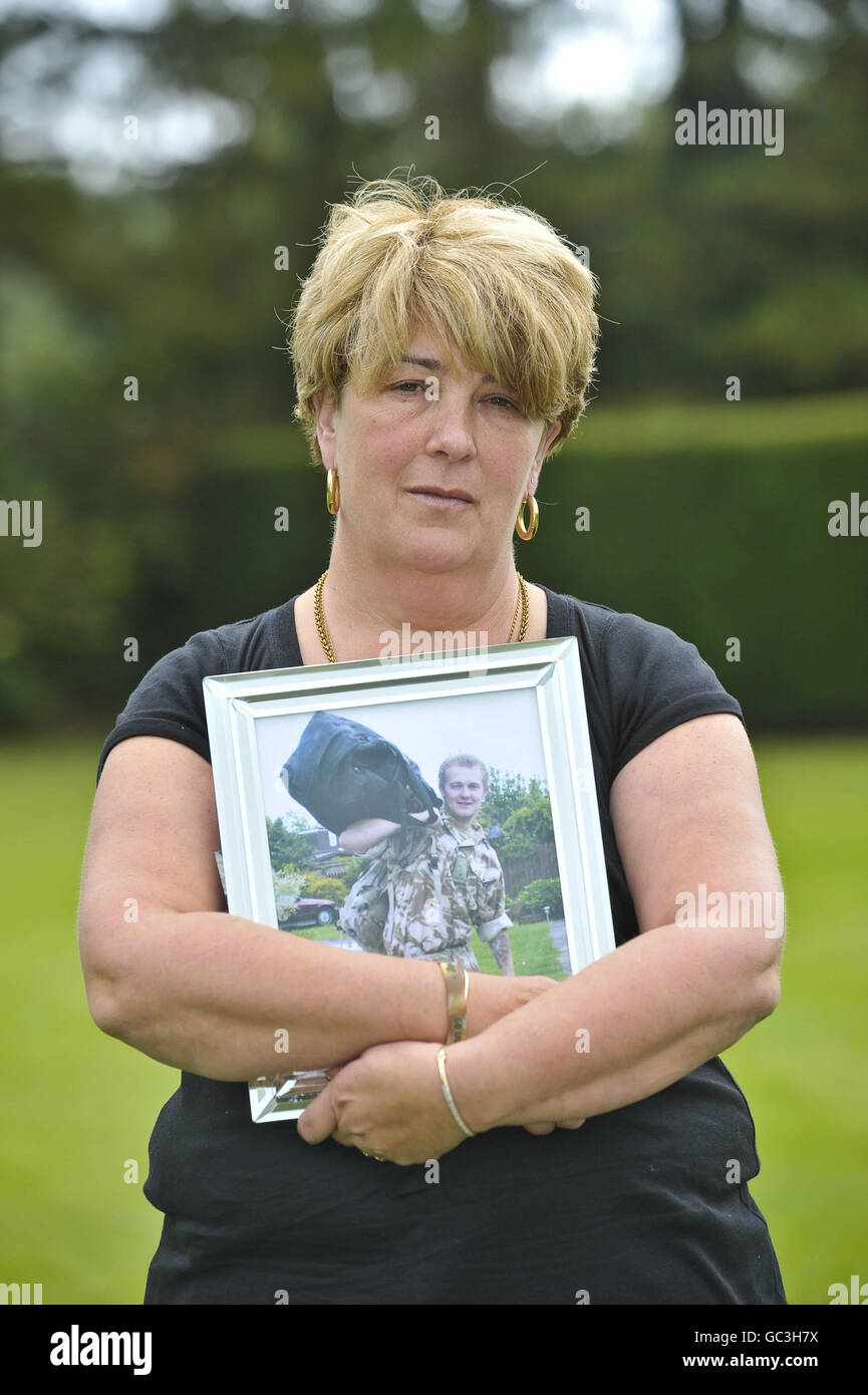 Deborah Simpson holds a photo of her son, Daniel Simpson from Croydon, after seven mothers, whose fallen sons who were all killed in Afghanistan, hold a press conference in Redwood Lodge, Failand, Bristol, as they come together to form a charity called Afghan Heroes. Stock Photo