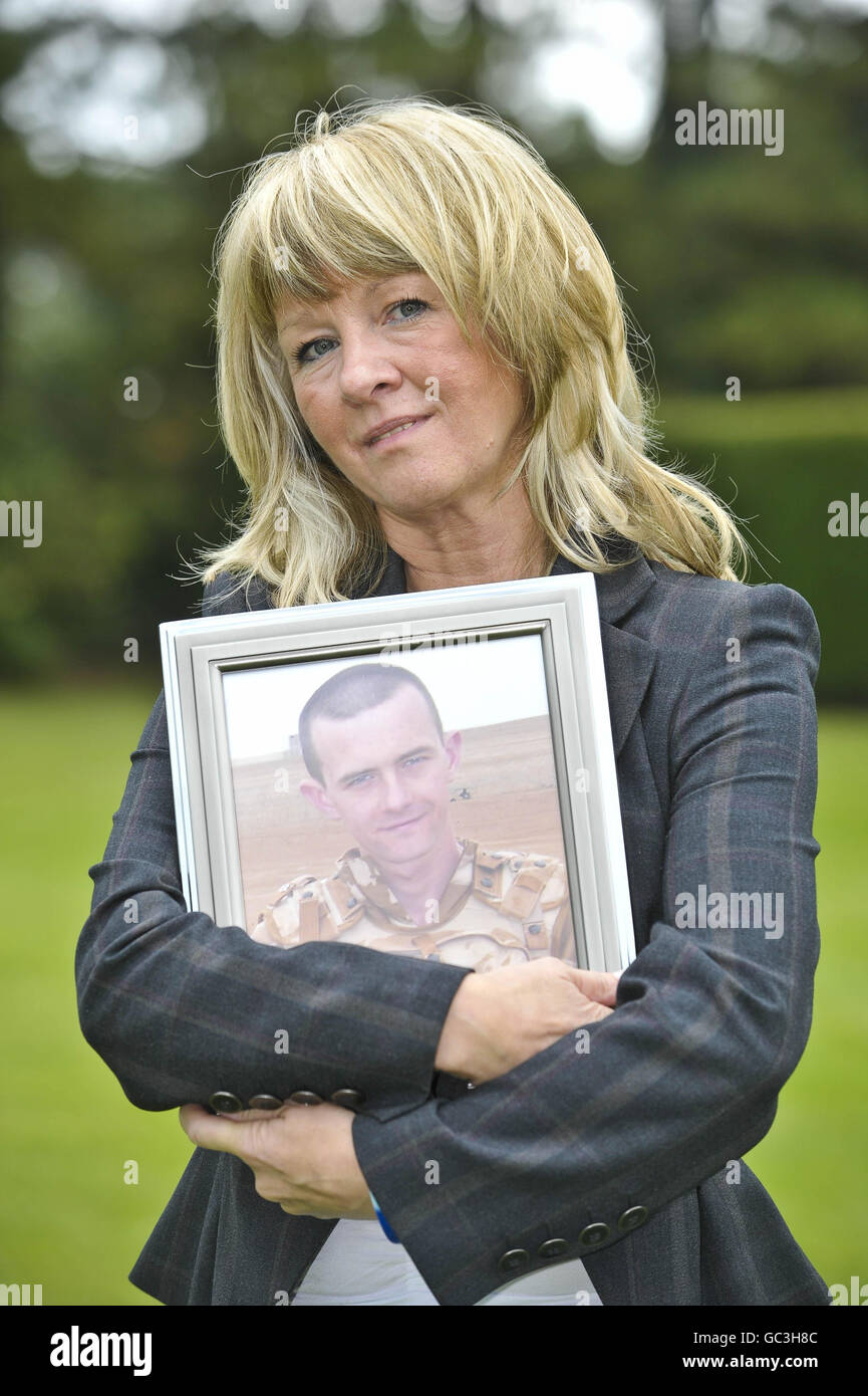 Jillian Murphy holds a photo of her son, Rifleman Joseph Murphy from Birmingham, after seven mothers, whose fallen sons who were all killed in Afghanistan, hold a press conference in Redwood Lodge, Failand, Bristol, as they come together to form a charity called Afghan Heroes. Stock Photo
