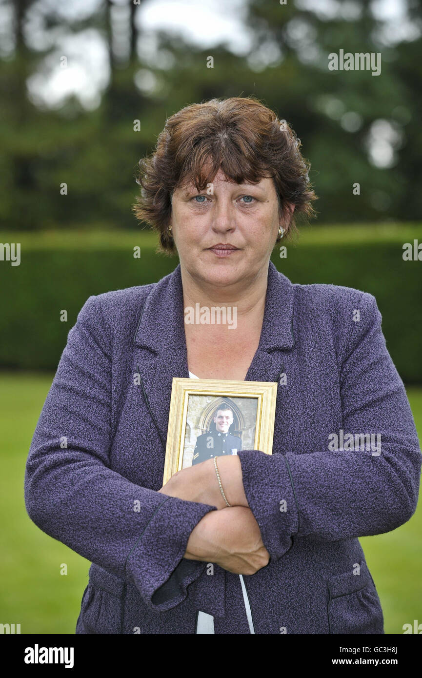 Denise Harris holds a picture of her son Cpl Lee Scott from Somerset, after seven mothers, whose fallen sons who were all killed in Afghanistan, hold a press conference in Redwood Lodge, Failand, Bristol, as they come together to form a charity called Afghan Heroes. Stock Photo