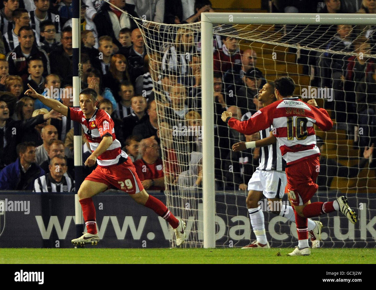 Doncaster Rovers' Waide Fairhurst (left) celebrates after scoring the opening goal of the game during a Coca-Cola Championship match at The Hawthorns, West Bromwich. Stock Photo