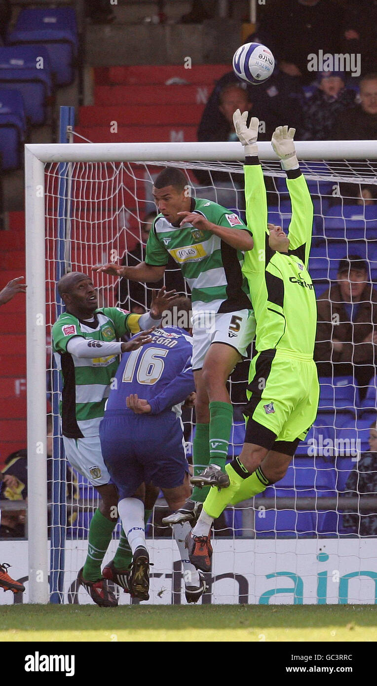 Oldham Athletic's goalkeeper Dean Brill saves from Yeovil Town's Sam Williams during the Coca-Cola League One match at Boundary Park, Oldham. Stock Photo