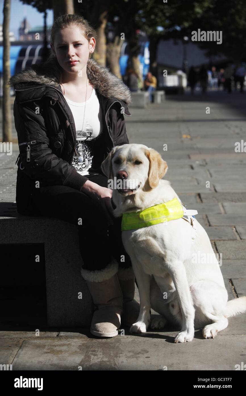 Kirsty Meinhardt 15 from Congleton with her Guide Dog Websta, one of the first four people under sixteen to qualify for a Guide Dog in the UK who were united for the first time on London's Southbank. Press Association Photo. Date Sunday 04 October 2009. Over 18,000 blind and partially sighted youngsters are missing out on crucial help with mobility, independence and life skills according to research by Guide Dogs. Picture Credit should read David Parry/ PA Stock Photo