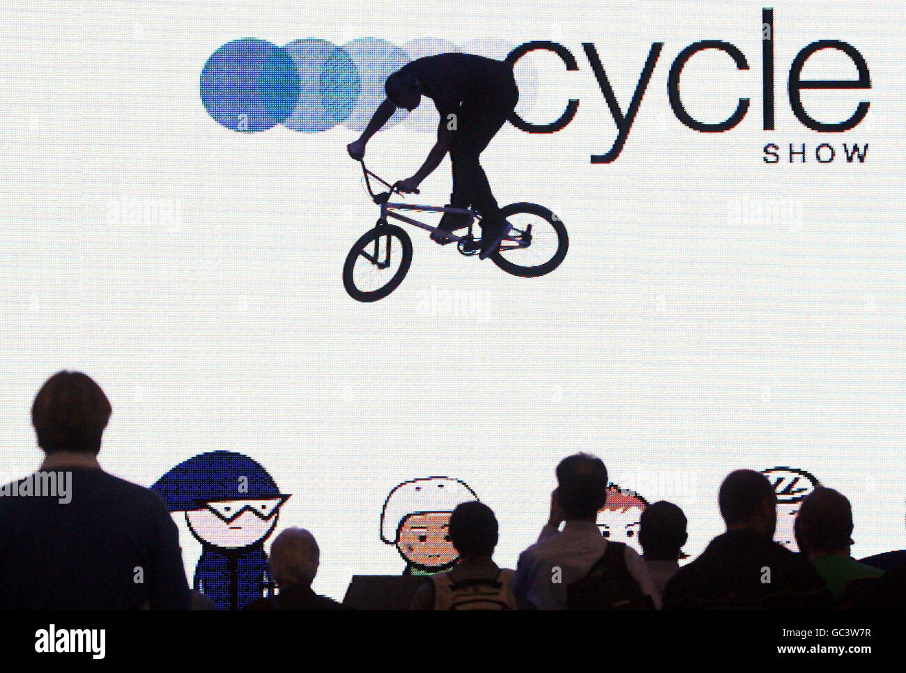 A BMX rider performs a '360' during a display at the Cycle Show at ...