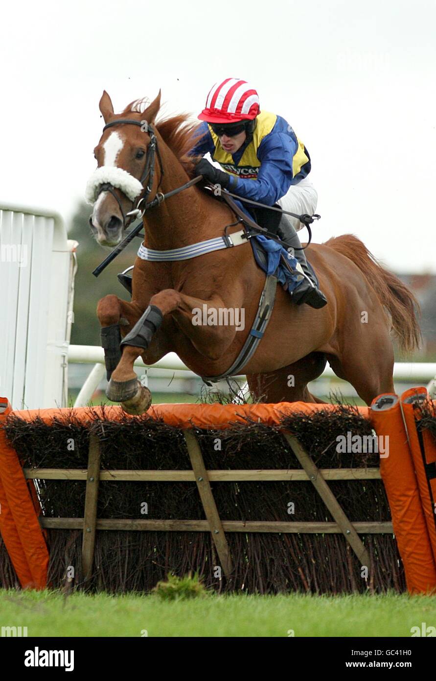 Mayfair Tambourine, ridden by Dave Crousse, during the Leukaemia Care Handicap Hurdle Race at Hereford Racecourse Stock Photo