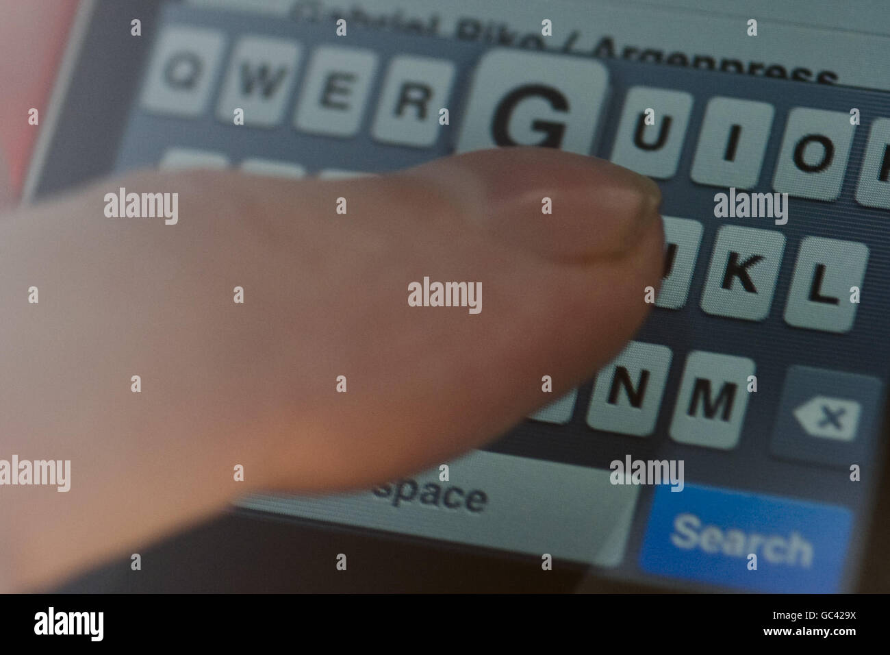 Technology. A touchpad qwerty keyboard on an ipod touch Stock Photo