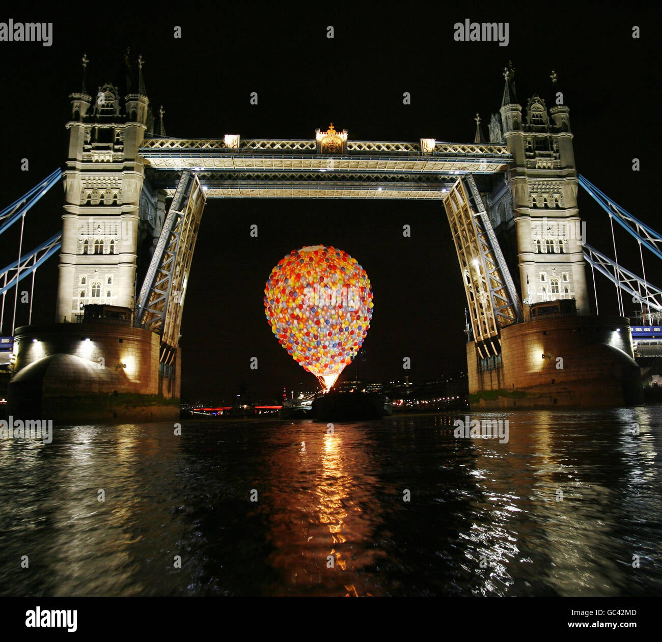 The UP hot air balloon passes Tower Bridge in London, which opened so