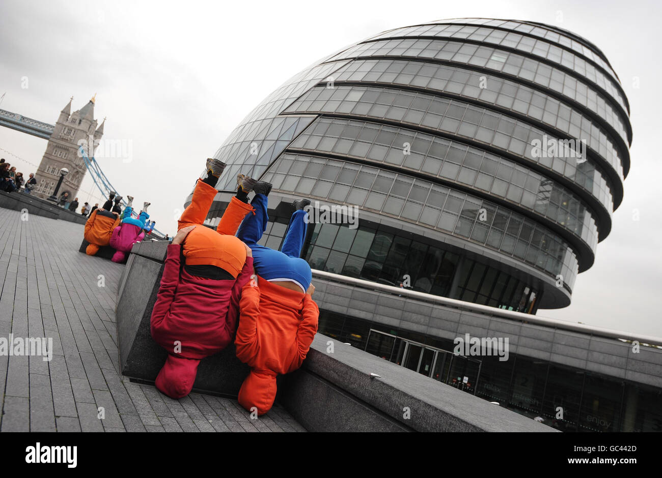 Bodies in Urban Spaces a human artwork by Austrian artist Willi Dorner, near the Mayor's Office on London's Southbank today. The 'moving body trail' featuring 24 performers is taking place in the Tower Bridge area until Sunday. Stock Photo