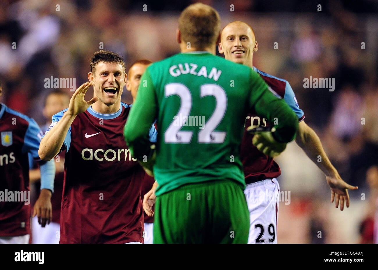 Aston Villa's James Milner (left) and Danny Collins (right) congratulate goalkeeper Brad Guzan after their victory in the penalty shootout against Sunderland during the Carling Cup match at the Stadium of Light, Sunderland. Stock Photo