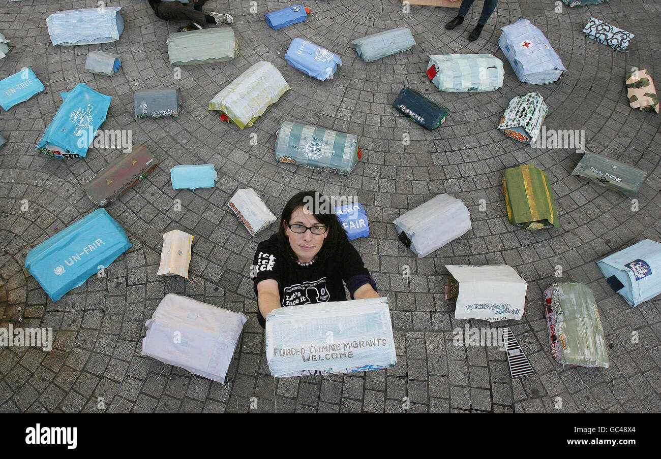 Joanna Rea from Oxfam Ireland sits in an imagined climate refugee camp set up outside the Central Bank in Dublin and other European capitals ahead of EU Heads of State climate finance summit in Brussels tomorrow. Stock Photo