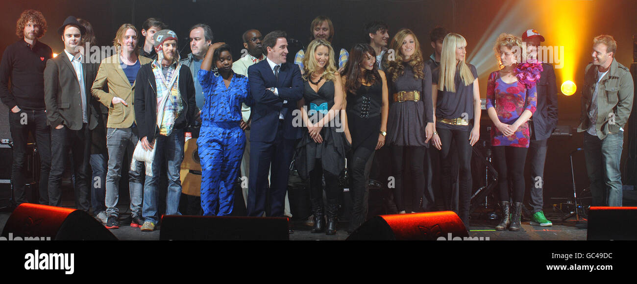 Celebrities gather on stage at the O2 Brixton Academy before taking part in a charity concert in aid of CARE this evening. The participants include (left to right) Kaiser Chiefs, Damien Rice, David Arnold, Speech Debelle, David McAlmont, Rob Brydon, Bond, The Rumble Strips, Beth Rowley and Gary Barlow. Stock Photo