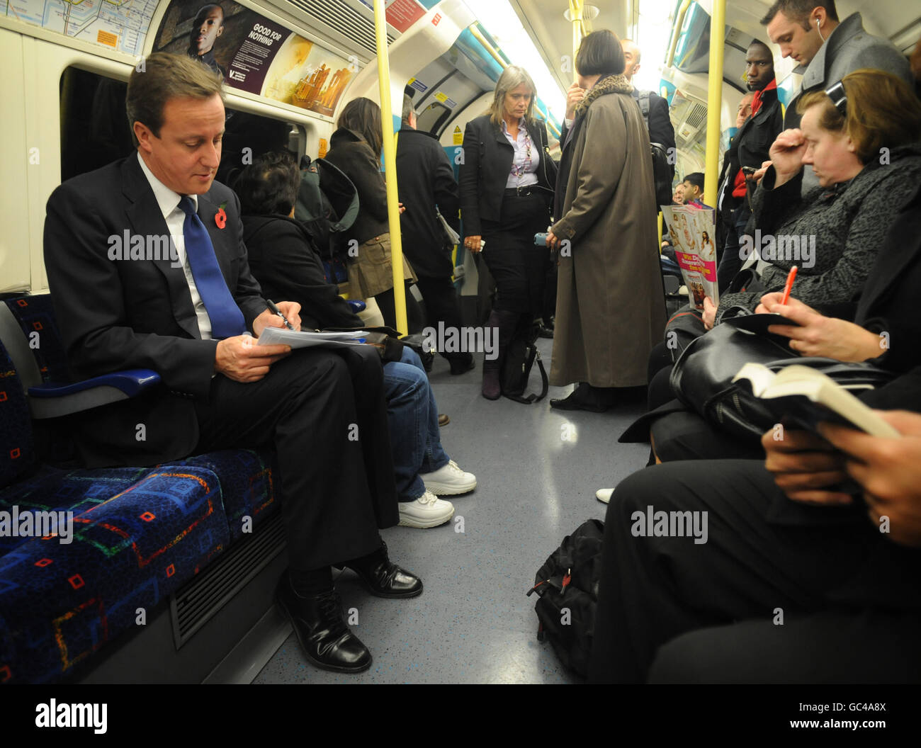 Conservative leader David Cameron travels by tube on the Underground to the O2 Arena in London today where he launched his Tickets for Troops scheme encouraging promoters of music concerts and sporting events to give free tickets to soldiers. Stock Photo