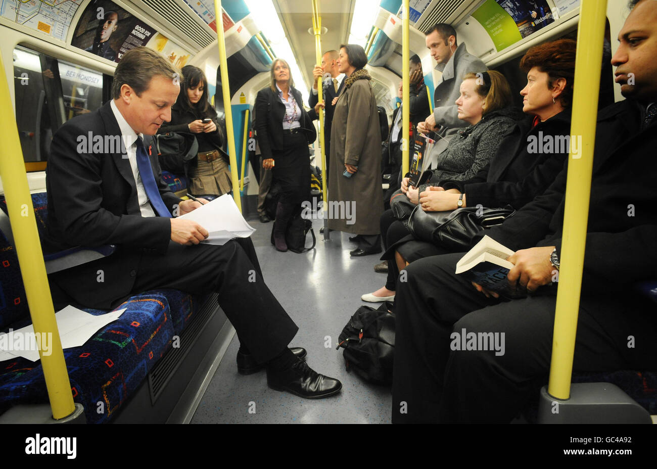 Conservative leader David Cameron travels by tube on the Underground to the O2 Arena in London today where he launched his Tickets for Troops scheme encouraging promoters of music concerts and sporting events to give free tickets to soldiers. Stock Photo