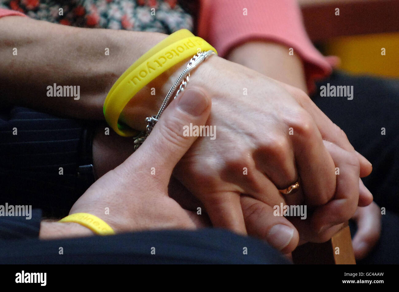 Kate and Gerry McCann hold hands during an interview following the launch of a new video by the Child Exploitation and Online Protection (CEOP) initiative, at the Millbank Studios in London, as the couple continue the search for their daughter, Madeleine, who disappeared while on holiday in Portugal in May 2007. Stock Photo