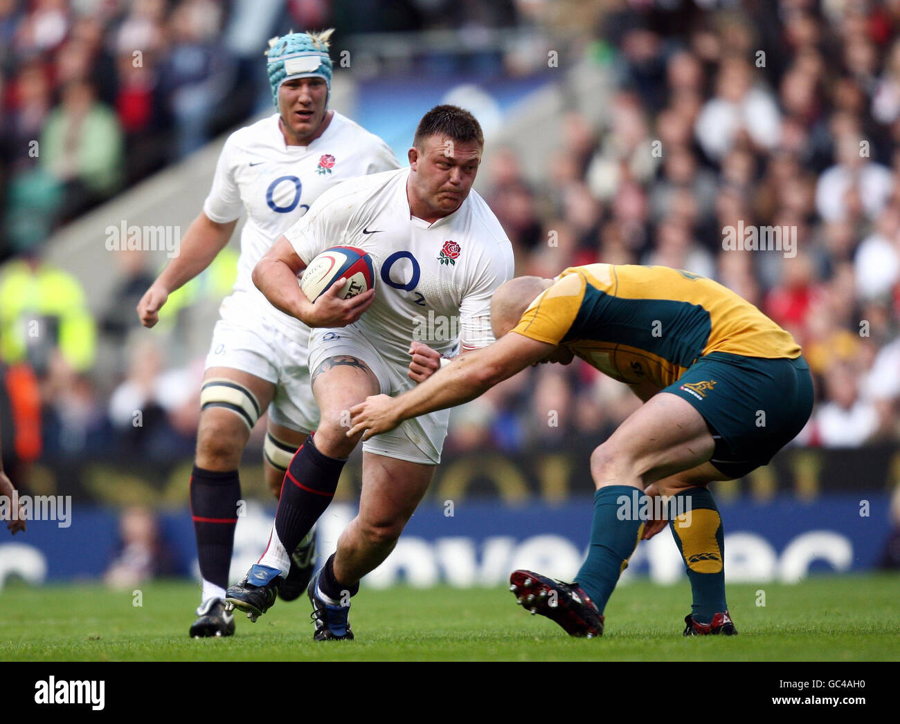 England's David Wilson surges into the tackle of Australia's Stephen Moore during the Investec Challenge Series match at Twickenham Stadium, London. Stock Photo