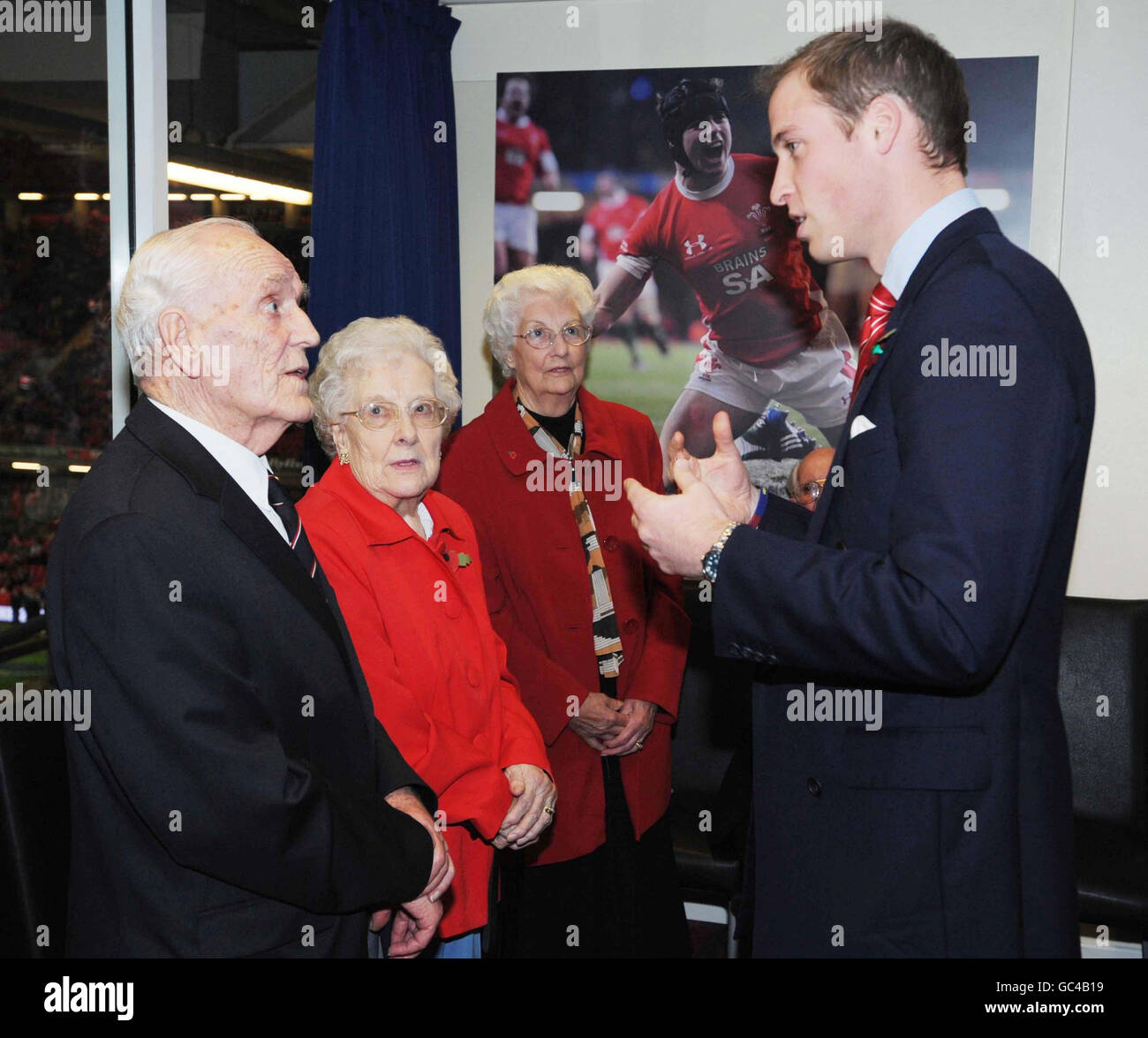 Prince William talks with 85 year old David Bees from Caerphilly, who served with the Royal Navy from 1942-1946, watched by his wife Jean (centre), before kick-off in the Wales v New Zealand match at the Millennium Stadium in Cardiff. Stock Photo
