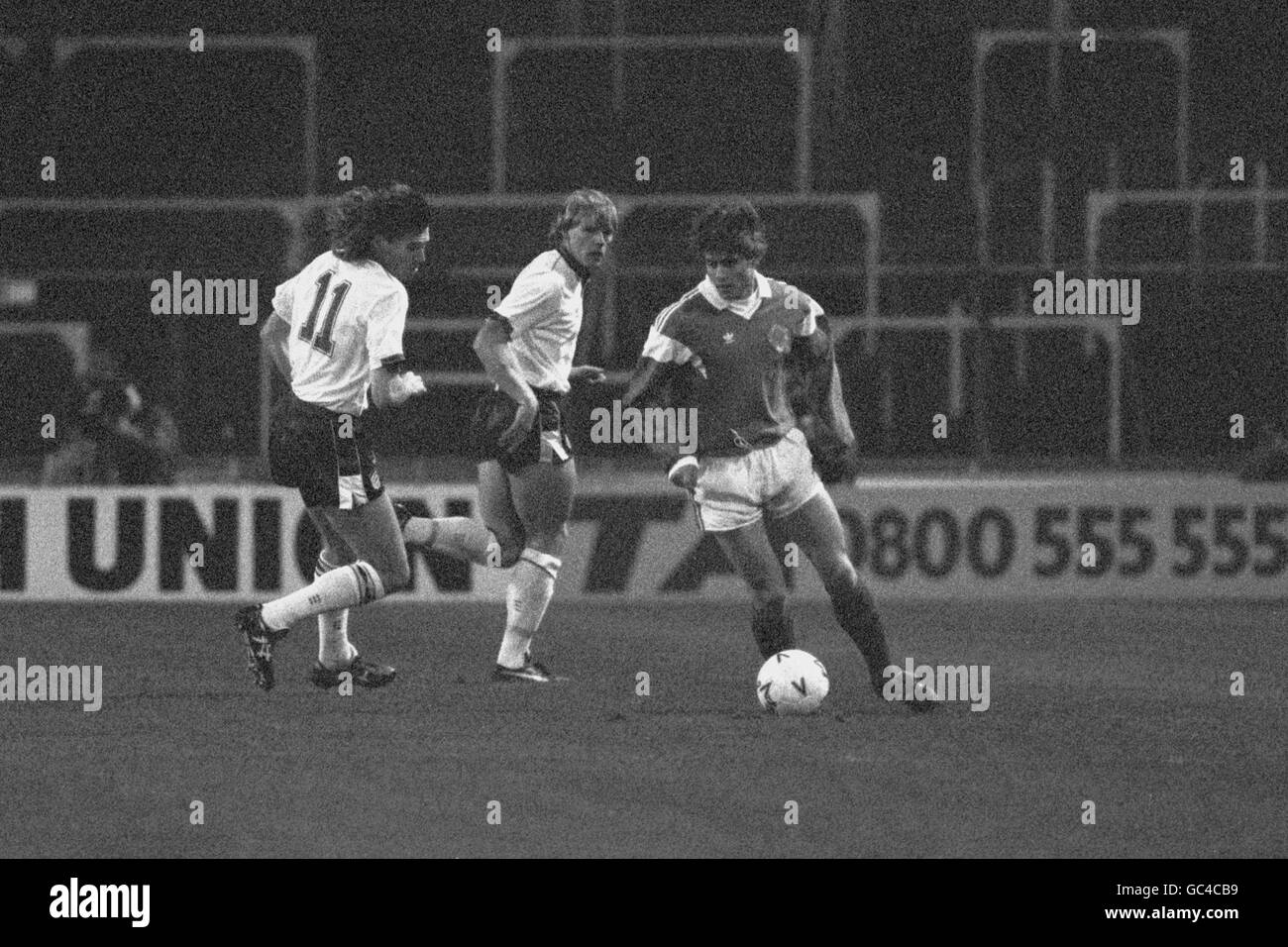Soccer - Friendly - England v Yugoslavia - Wembley Stadium. Yugoslavia's Dragan Stojkovic keeps England's Chris Waddle, left, and Stuart Pearce at bay. Stock Photo