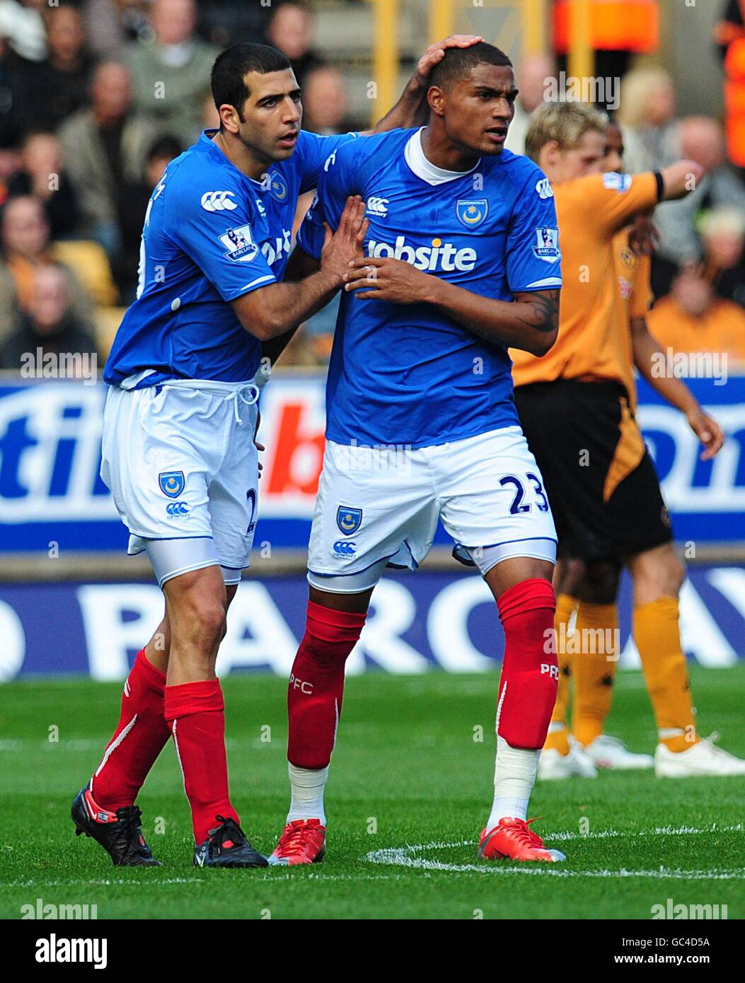 Portsmouth's Kevin-Prince Boateng (right) celebrates with Tal Ben-Haim (left) after their team mate Hassan Yebda (not in picture) scored the opening goal. Stock Photo