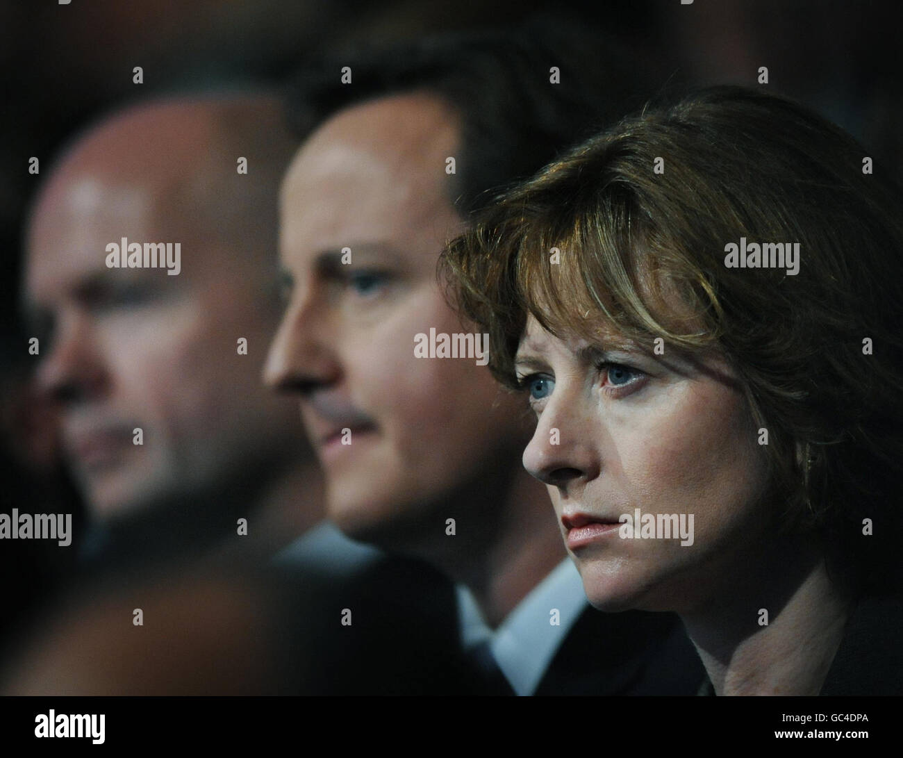 Shadow Chancellor George Osborne's wife Frances listens to her husband address the Conservative Party conference in Manchester along with party leader David Cameron (centre) and William Hague (far left). Stock Photo