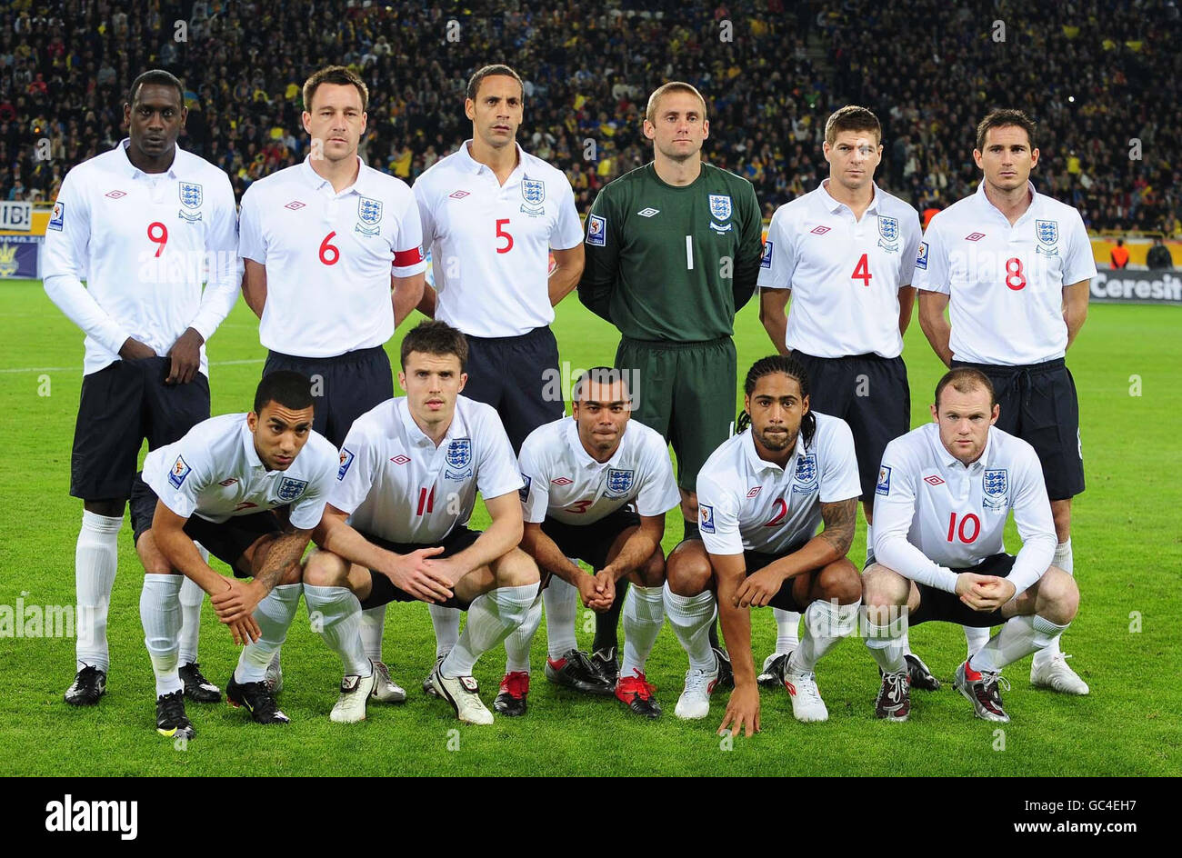 England's (left to right back row) Emile Heskey, John Terry, Rio Ferdinand, Robert Green, Steven Gerrard, Frank Lampard (bottom row left to right) Aaron Lennon, Michael Carrick, Ashley Cole, Glen Johnson and Wayne Rooney line up before the FIFA World Cup Qualifying match at the Dnipro Arena, Dnipropetrovsk, Ukraine. Stock Photo