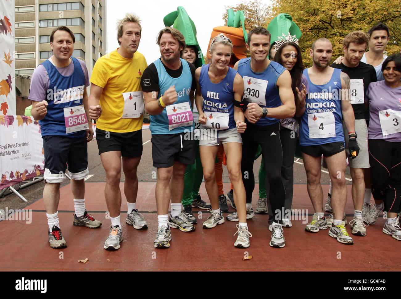 Celebrity participants, including (left to right) Gary Webster, Ben Fogle, Charley Boorman, Nell McAndrew, personal trainer Matt Roberts, Rachel Christie, ultra marathon runner Jackson Williams, Tom Aiken, Jeremy Edwards and Rani Price, taking part in the Royal Parks Foundation Half Marathon, which starts and ends in Hyde Park in central London. Stock Photo