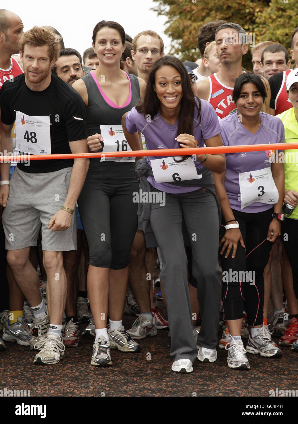 Celebrity participants, including (left to right front row) Tom Aiken, Beverley Turner, Rachel Christie and Rani Price taking part in the Royal Parks Foundation Half Marathon, which starts and ends in Hyde Park in central London. Stock Photo