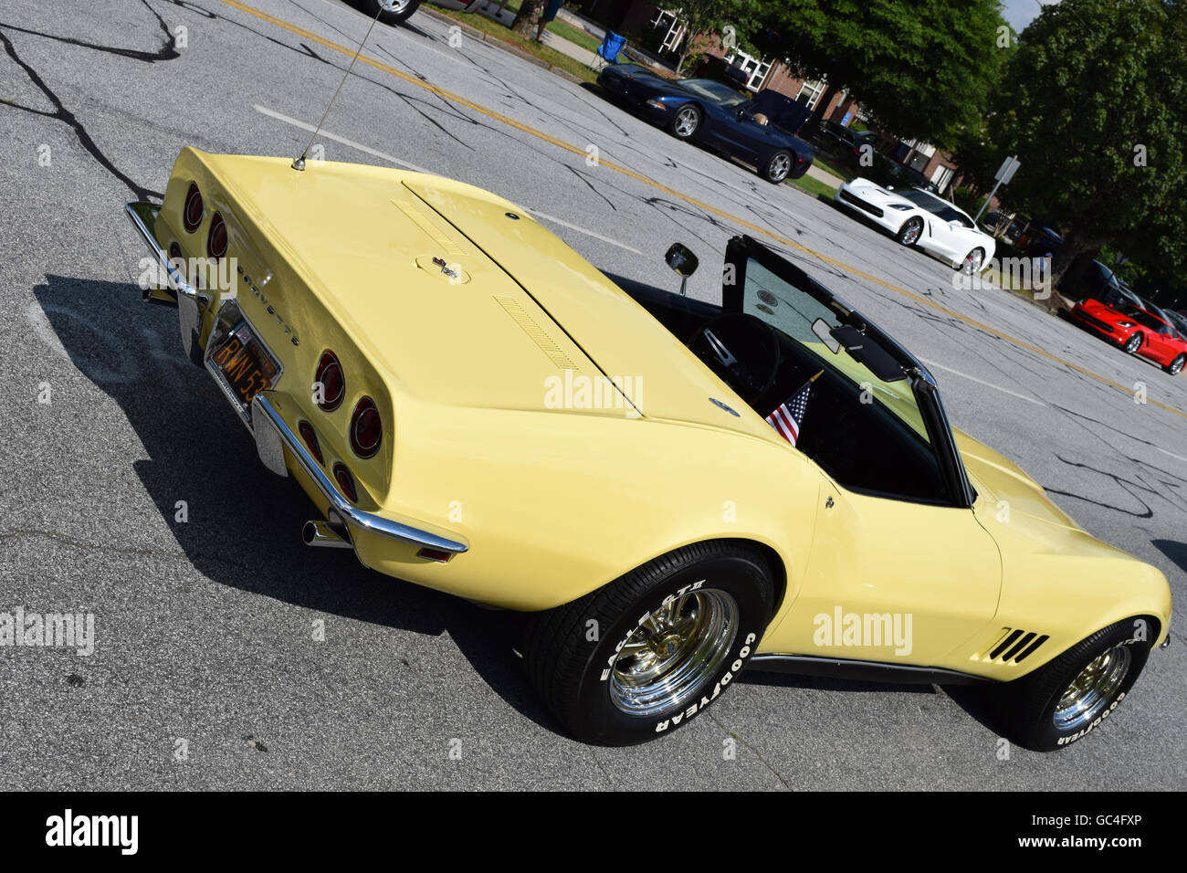 A yellow 1968 Corvette Convertible at a car show. Stock Photo