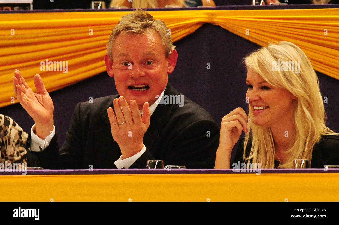 Actor Martin Clunes and (former Miss Wales 2004 and Gladiator Siren), Amy Guy watch the Horse of the Year Show at the NEC, Birmingham. Stock Photo