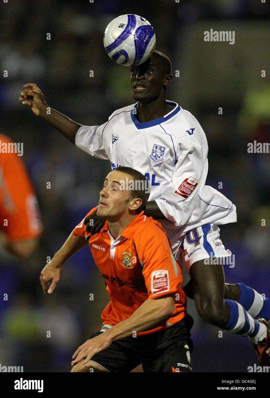 Stockport County's James Vincent (left) and Tranmere Rovers' Zoumana Bakayogo (right) in action Stock Photo