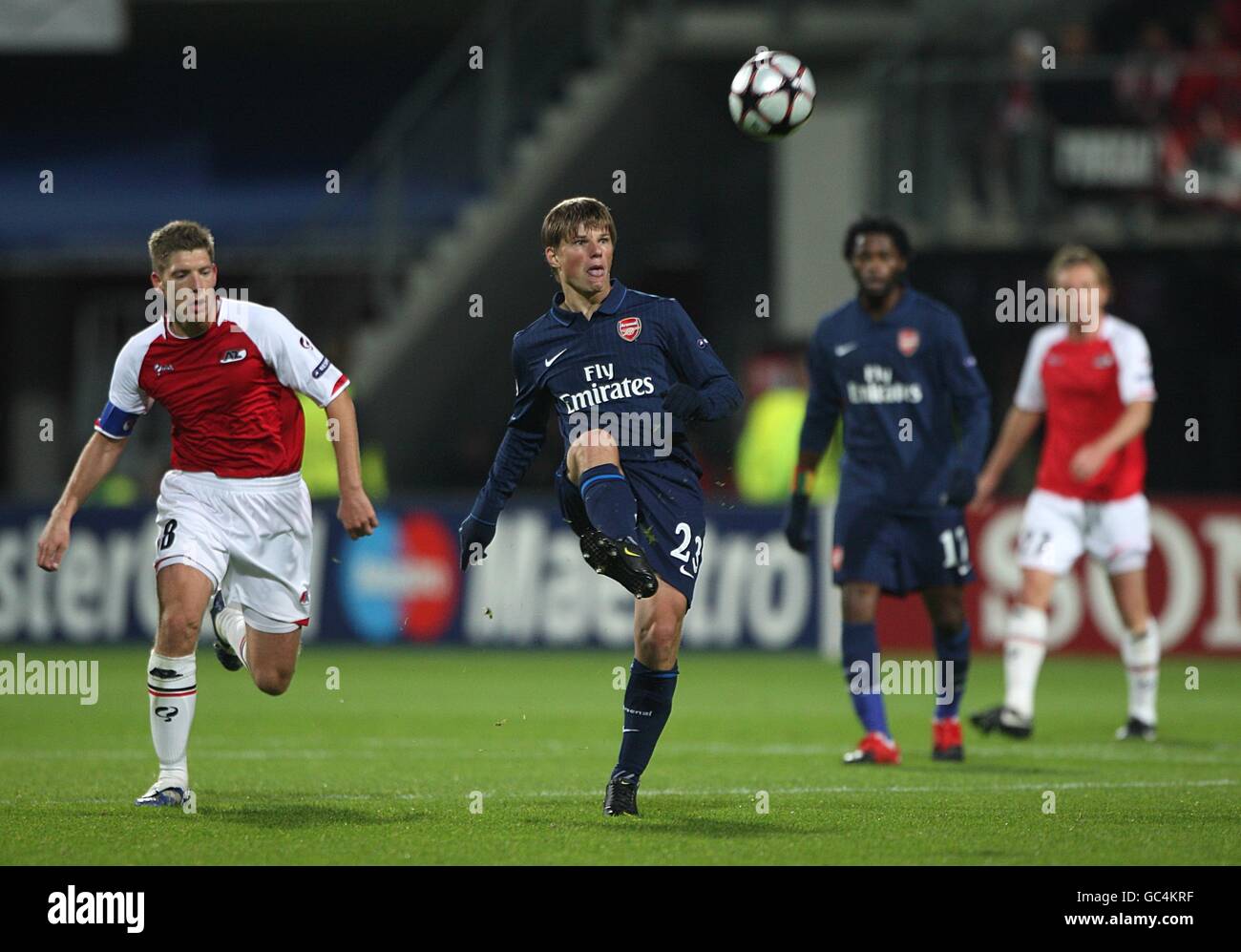 Arsenal's Andrey Arshavin (2nd left) lobs the ball forward Stock Photo