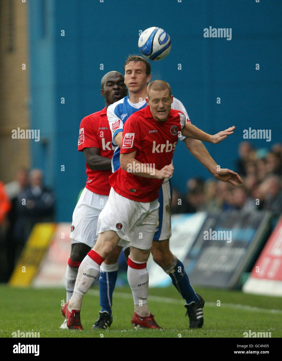 Charlton Athletic's Nicky Bailey (front) and Kelly Youga compete for the ball with Gillingham's Mark Bentley during the Coca-Cola League One match at the KRBS Priestfield Stadium, Gillingham. Stock Photo