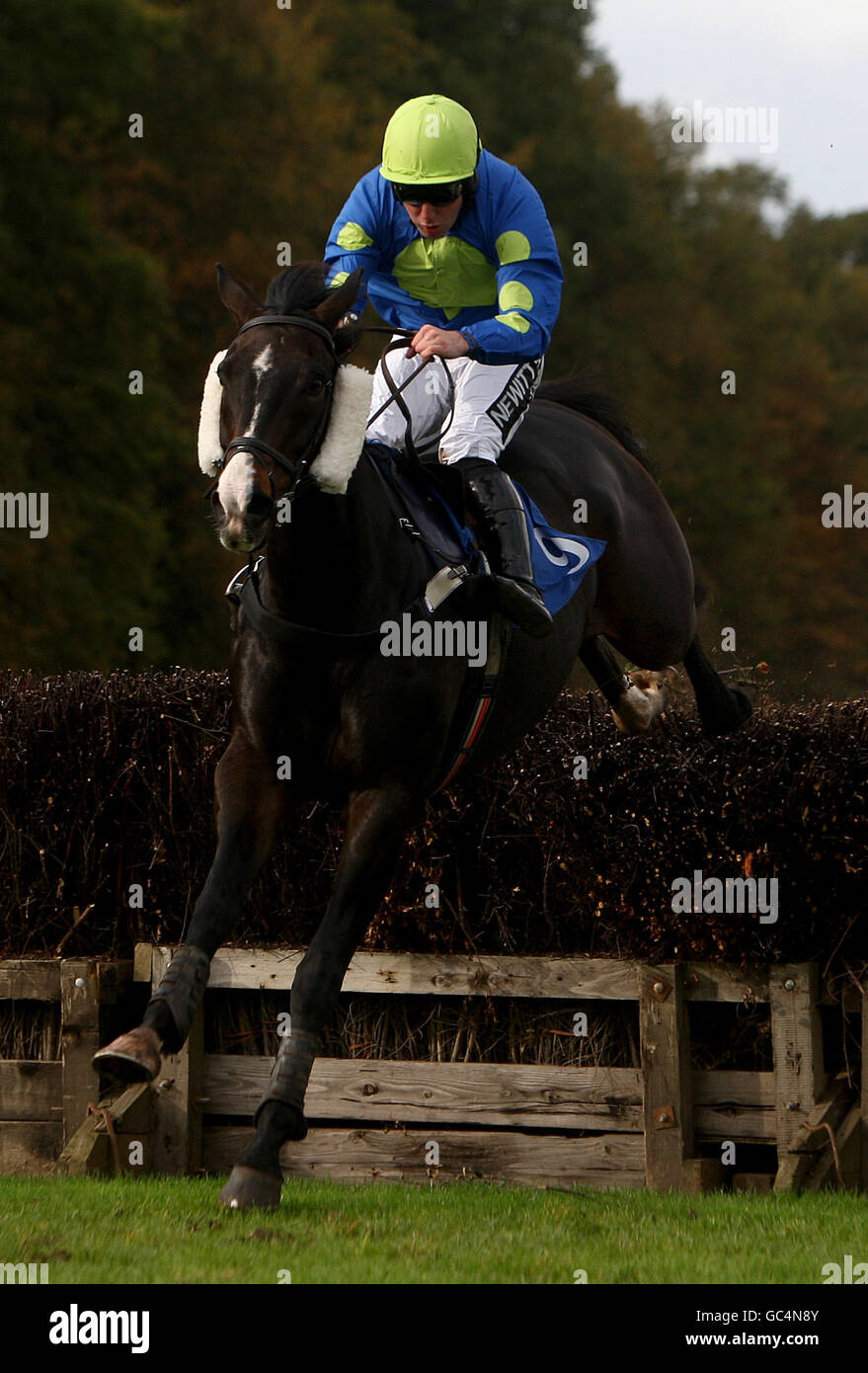 Jockey Andrew Tinkler on Devils River jumps the last in the Worcester's 2010 Season Starts May 9th Handicap Chase Stock Photo