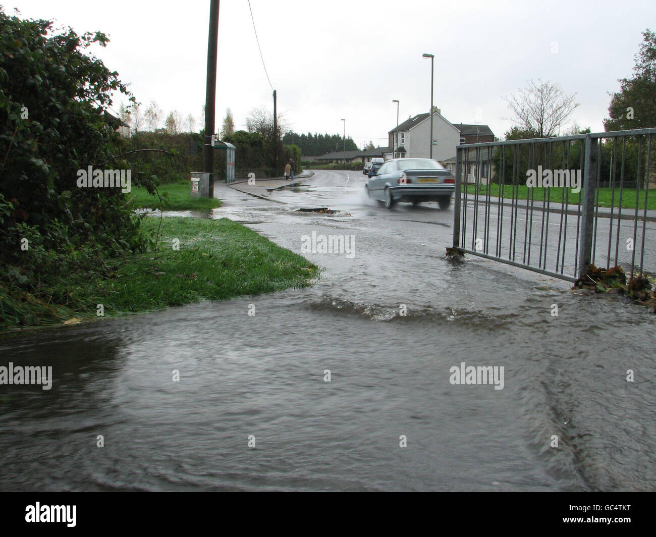 A flooded pavement in the Energlyn area of Caerphilly, South Wales as
