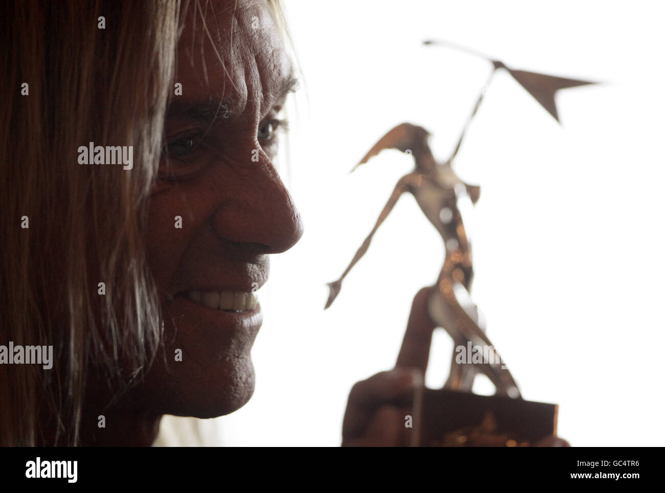 US musician Iggy Pop during a photocall at The Dorchester in central London to celebrate him receiving the 'Living Legend' award on the eve of the 5th annual Marshall Classic Rock Roll of Honour Awards ceremony. Stock Photo