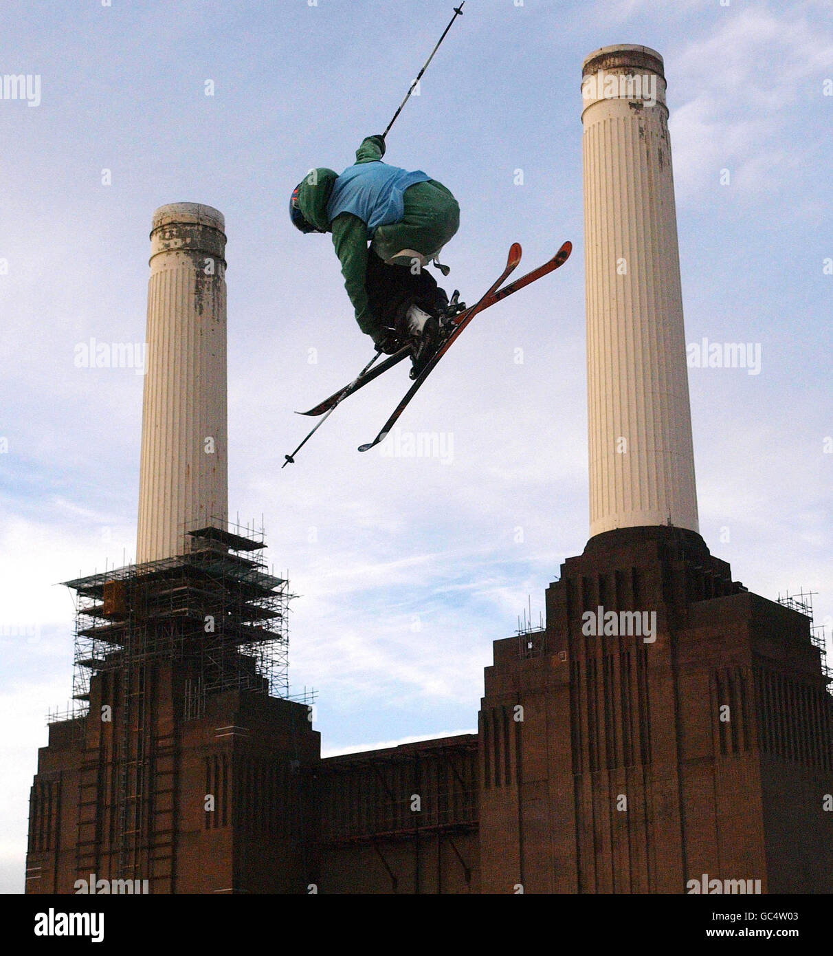 A freeskier goes past London's Battersea Power Station during their freeski practise at London Freeze weekend. Stock Photo