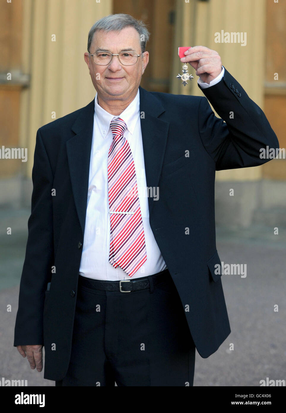 David Burgess with the MBE he received from Britain's Queen Elizabeth II during an investiture ceremony at Buckingham Palace in central London. Stock Photo