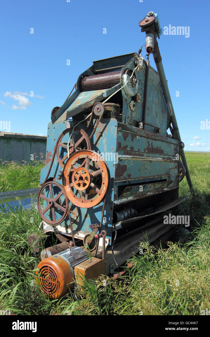 A Carter Disc Cylinder Separator, made by The Strong-Scott Manufacturing Company. On a farm in Alberta, Canada Stock Photo