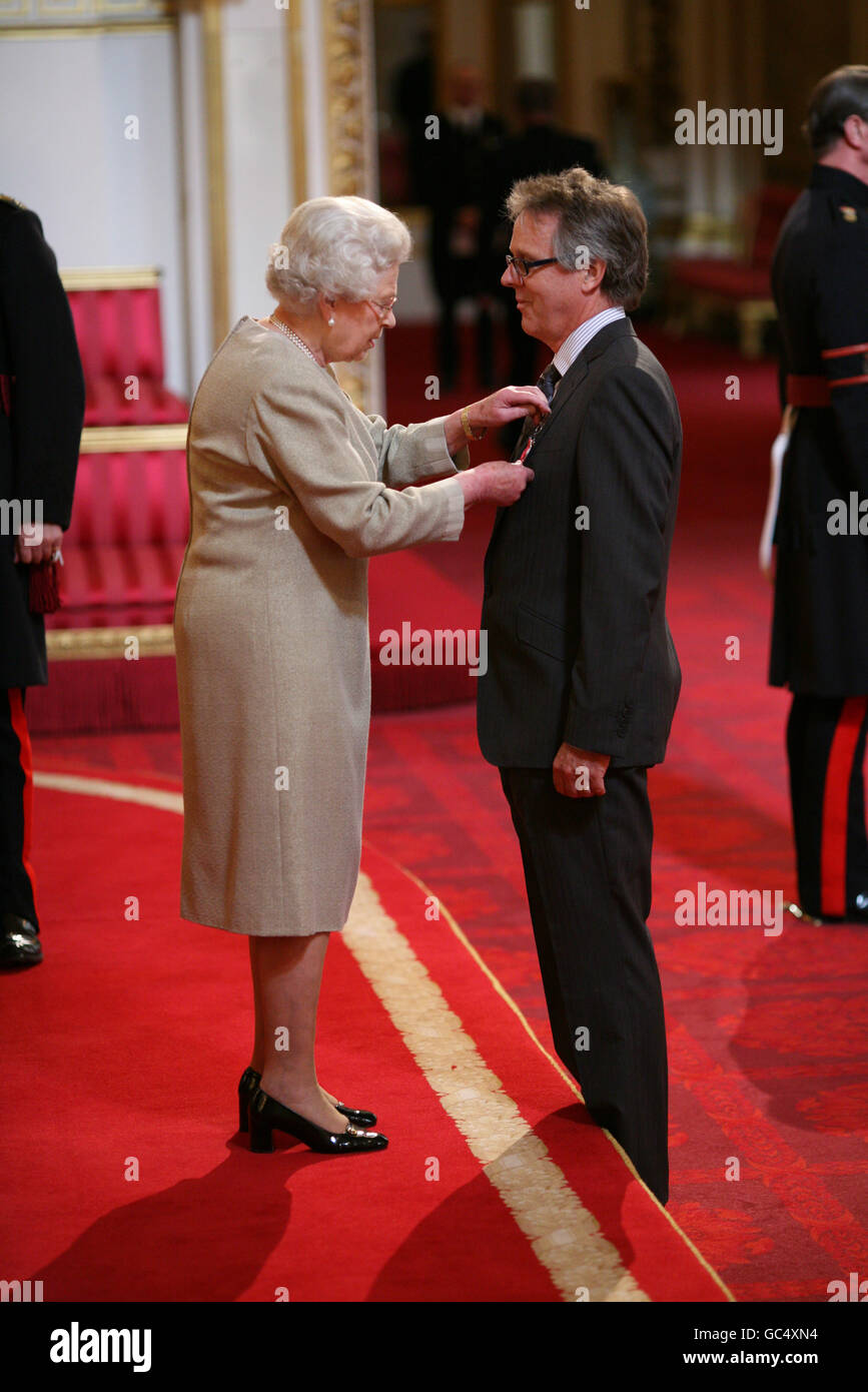 Mr. Richard Mawer from Cambridge is made an OBE by The Queen at Buckingham Palace. Stock Photo